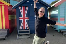 Christoph jumping in front of Australian flag
